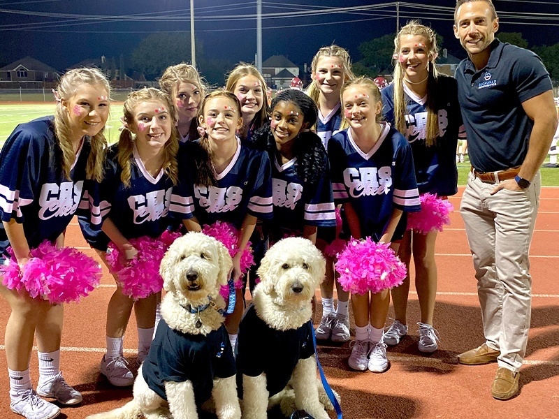 Doctor Buchwald with middle school cheerleading team